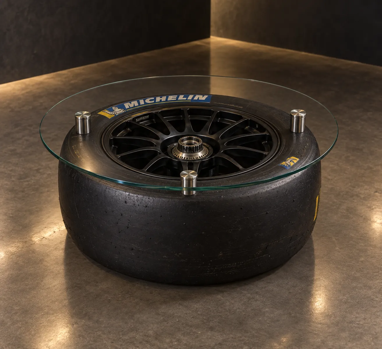 Slick Table concept: a racing slick on its wheel, laid flat under a round glass top. Concept rendering.